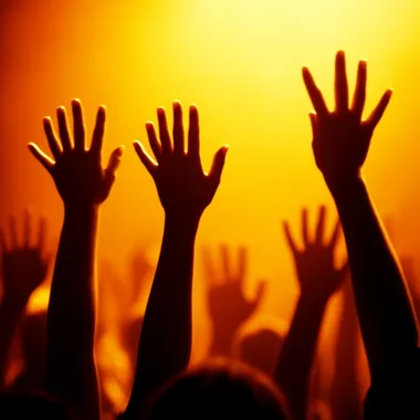 Festival crowd with hands in the air, stunning LED stage visuals, room for advertising content   773tzfv