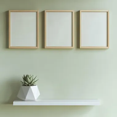 3 vertical wooden picture frames hang on a light olive green wall with a blank interior. Positioned at one-third of the height from the top, in the lower left corner is a smaller wooden frame leaning against the wall. In front of the lower right corner is a minimalist white shelf with a small succulent in a geometric pot, Center the composition, closeup view, Bright, photoreal, Landscape Photography, high quality, no human shows up ar 3:4  --s 50