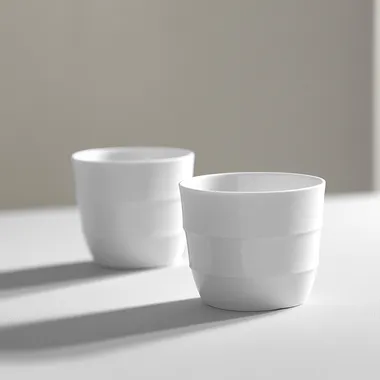 QSv18t08jztr A sleek and modern coffee cup with a minimalist design, perfect for a contemporary cafe.