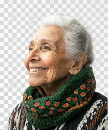 studio photography of old woman smiling with closed mounth. Her clothing has green details. She is looking at something on the left. White solid background.