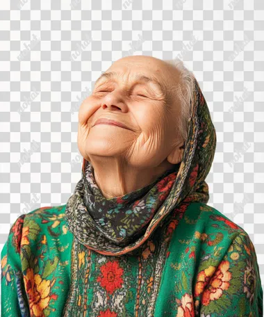 studio photography of old woman smiling with closed mounth. Her clothing has green details. She is looking at something on the left. White solid background.
