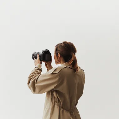 a woman taking photo with a camera, movie shot, back side view full body, shot by erwin olaf, pure white background